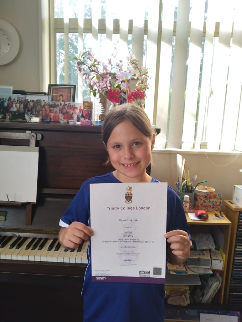 Valentina getting a Distinction for her singing exam -2025.