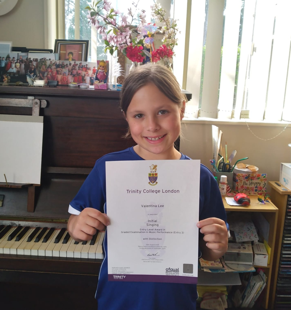 Valentina getting a Distinction for her singing exam -2025.